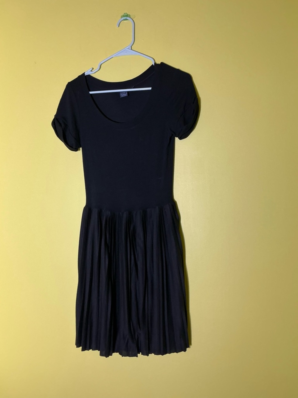 Black French Connection dress with puffy sleeves and pleated skirt